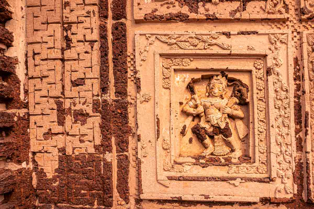 lord hanuman sculpted on temple wall