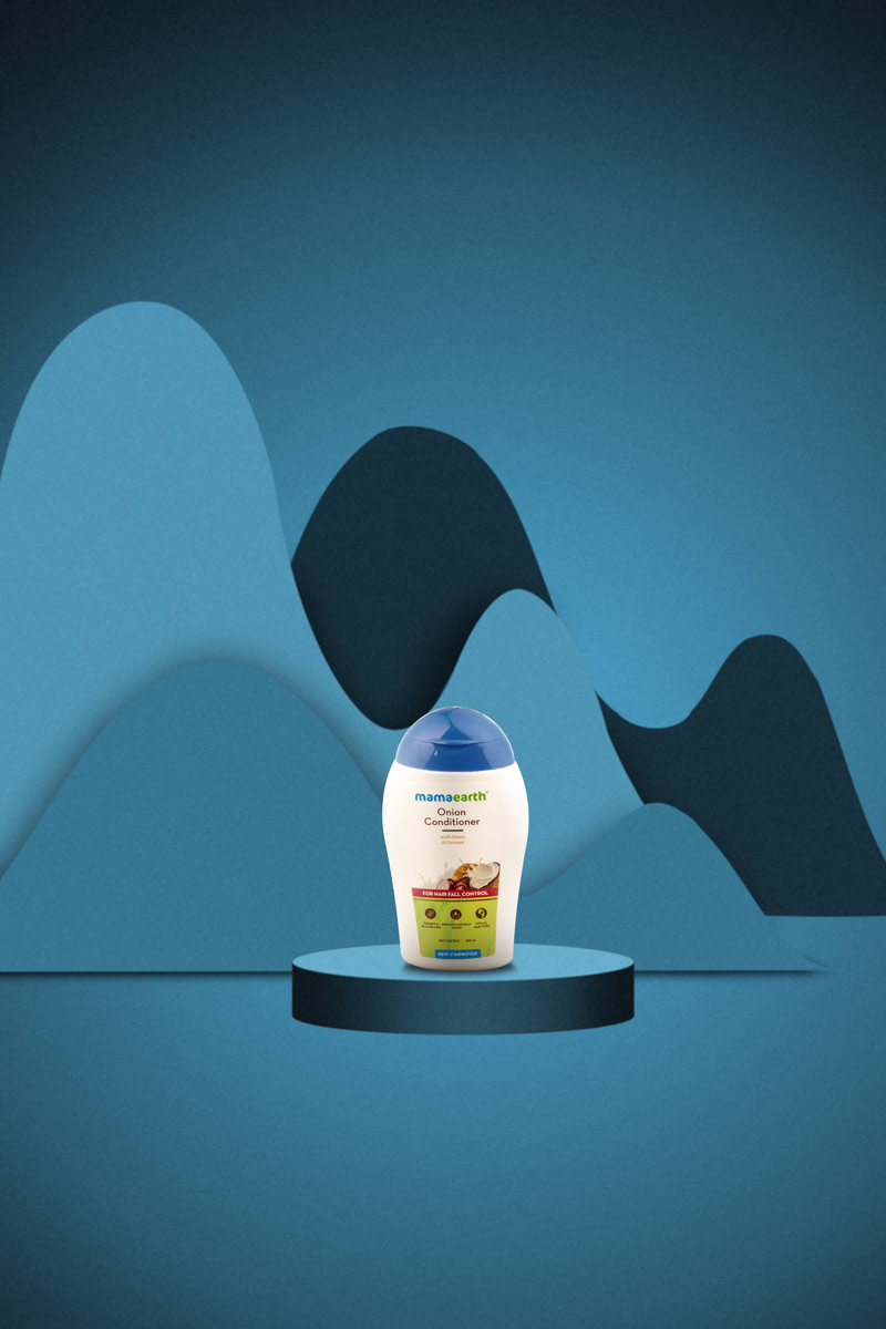 small bottle onion conditioner in a blue background